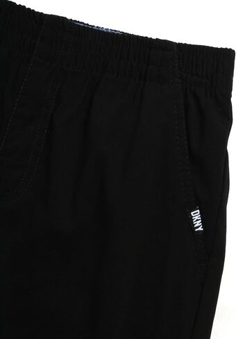 طقم سراويل للأولاد من DKNY - قطعتين من قميص بولو بأكمام قصيرة وسروال تقني - مجموعة ملابس كاملة للأولاد (8-12) in Saudi Arabia