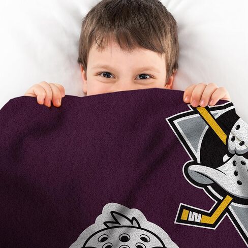 Sleep Squad Edmonton Oilers Connor McDavid 60" x 80" Raschel Plush Blanket – an NHL Throw in Kuwait