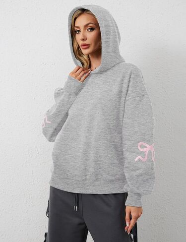 سترة نسائية بغطاء للرأس مطبوعة بفيونكة كبيرة الحجم ومزودة بغطاء للرأس وأكمام طويلة ورسومات لطيفة وكتف منسدل in Kuwait