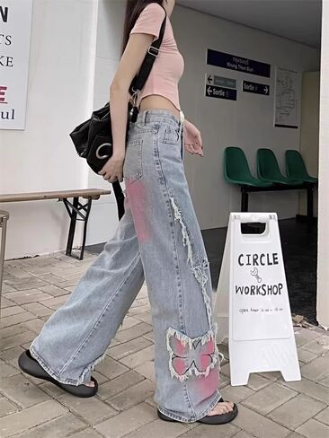 Y2K Baggy Ripped Jeans for Women – Wide Leg Butterfly Print & Star Patch Distressed Denim Pants High Waist Streetwear in Saudi Arabia