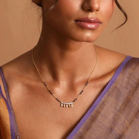 قلادة مانغالسوثرا الأنيقة من الفضة الإسترلينية من تارينيكا مع تصميم سحر الأزهار (مطلي بالذهب) - قلادة سلسلة فضية للنساء | مثالي للمناسبات العرقية | اطقم مجوهرات هندية للنساء | 1 سنة in Kuwait