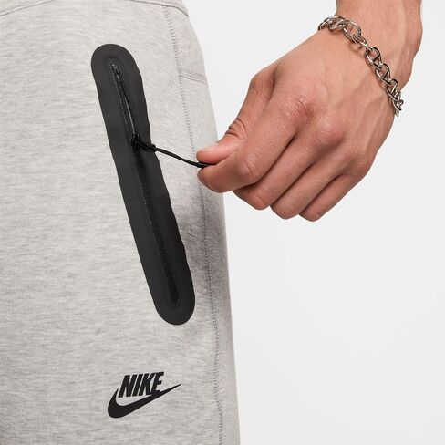TECH Fleece بنطال بحاشية مفتوحة "رمادي هيذر" in Saudi Arabia