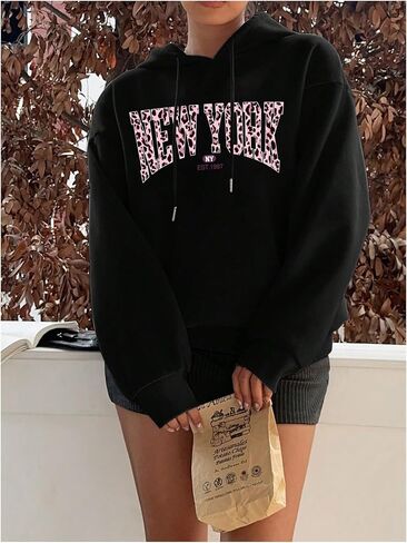WDIRARA Women's Leopard Letter Graphic Hoodies Long Sleeve Pullover Hooded Sweatshirts in Saudi Arabia