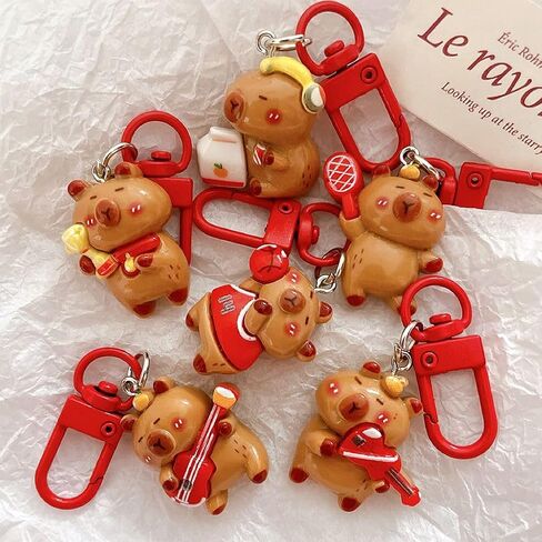 12Pcs Cute Capybara Keychains Kawaii Sport Capybara Pendant Accessories for DIY Bag Charm Phone Charms Wallet Birthday Christmas Gifts in Saudi Arabia