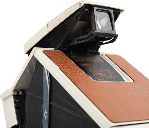 كاميرا بولارويد SX-70 Land Camera Model 2 - كاميرا فيلم فورية كلاسيكية (جسم أبيض، جلد بني) | التركيز اليدوي، تصميم قابل للطي، يعمل مع فيلم SX-70 (متجدد) in Saudi Arabia
