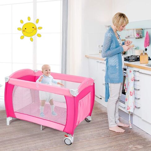 Costzon 4 in 1 Pink Pack and Play with Bassinet, Portable Baby Playard with Adjustable Canopy, Side Zipper Entrance, Music Box, Wheels/Brake, Foldable Infant Pink Bassinet for Baby Girl Toddlers in Saudi Arabia