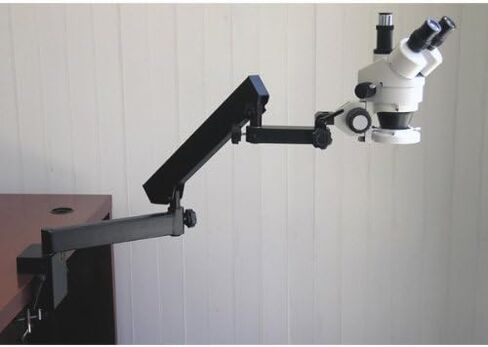 AmScope SM-6TY-FRL Professional Trinocular Stereo Zoom Microscope, WH10x Eyepieces, 7X-90X Magnification, 0.7X-4.5X Zoom Objective, 8W Fluorescent Ring Light, Clamping Articulating Arm Stand, 110V-120V, Includes 2.0X Barlow Lens in Saudi Arabia