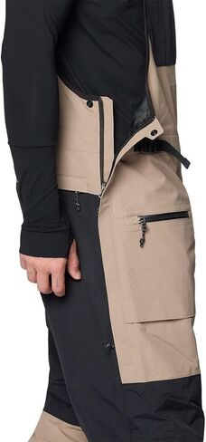 Mountain Hardwear، بنطلون مريلة First Tracks - للرجال، Dunes/Black، L/Reg in Saudi Arabia