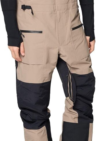 Mountain Hardwear، بنطلون مريلة First Tracks - للرجال، Dunes/Black، L/Reg in Saudi Arabia