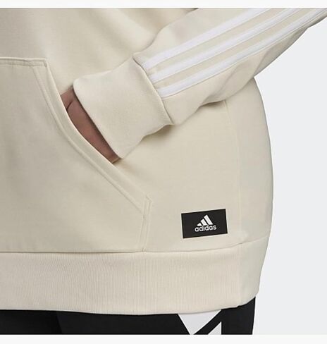 سويت شيرت بقلنسوة Future Icons 3-Stripes للنساء من Adidas (مقاس كبير)، كريمي in Saudi Arabia