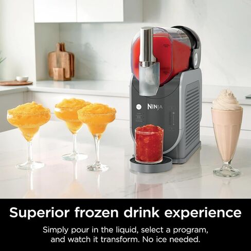 Ninja FS300 Slushi 72oz. حزمة Frozen Drink & Slushie Machine (متجددة) مع Deco Essentials زجاجة ماء قابلة للانهيار BPA Free 24oz رمادي/غير قانوني و 1 سنة CPS حماية محسنة in Kuwait