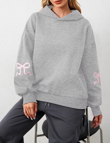 سترة نسائية بغطاء للرأس مطبوعة بفيونكة كبيرة الحجم ومزودة بغطاء للرأس وأكمام طويلة ورسومات لطيفة وكتف منسدل in Kuwait