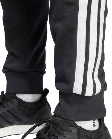 adidas Men's Essentials 3-Stripes French Terry Pants in Saudi Arabia