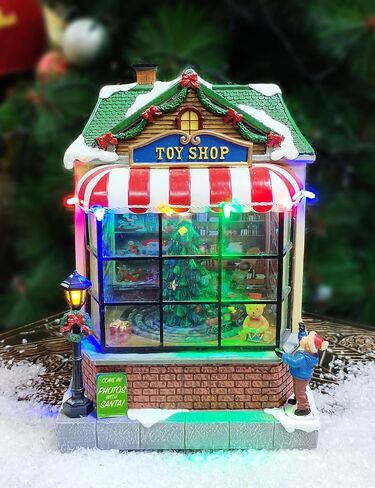 MOMENTS IN TIME 9.7"H Animated Toy Shop (Moving Tree) - LED Lights, 8 Classic Carols Christmas Music, Battery Operated Christmas Village - Hand-Painted Polyresin in Saudi Arabia