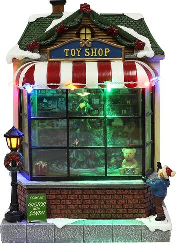 MOMENTS IN TIME 9.7"H Animated Toy Shop (Moving Tree) - LED Lights, 8 Classic Carols Christmas Music, Battery Operated Christmas Village - Hand-Painted Polyresin in Saudi Arabia