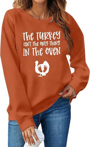 Thanksgiving Pregnant Sweatshirt Women The Turkey ain't The Only Thing in The Oven Shirt Funny Maternity Pullover Tops in Saudi Arabia