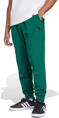 بنطال رياضي من الصوف من adidas Essentials Feel Cozy للرجال، أخضر جامعي/أسود، مقاس كبير in Saudi Arabia