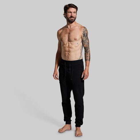 بنطال رياضي Cloud Jogger للرجال من Born Primitive - بنطال رياضي فائق النعومة وقابل للتمدد مع جيوب بسحاب وحزام خصر برباط لأيام التعافي in Kuwait