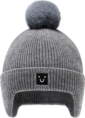 Baby Beanie with Ear Flaps pom pom Smiley Embroidery- Skin Friendly Fleece Lining Winter hat for Infant 0-24M in Saudi Arabia