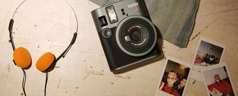 FujiFilm Instax Mini 41 Instant Camera Bundle with Fuji Instax-Instant-mini Film Value Pack (20 Sheets) + Photo Album – 64 Pockets + Vintage Style Compatible Carrying Case Brown in Saudi Arabia